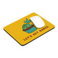 A yellow Let's Get Baked Mouse Pad with a cupcake design on front with a weed leaf protruding out of the top. 