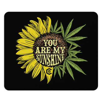 This photo highlights the best of both worlds with the You Are My Sunshine Mouse Pad that conjoins a sunflower and cannabis leaves to make a complete plant with the words you are my sunshine in the center.