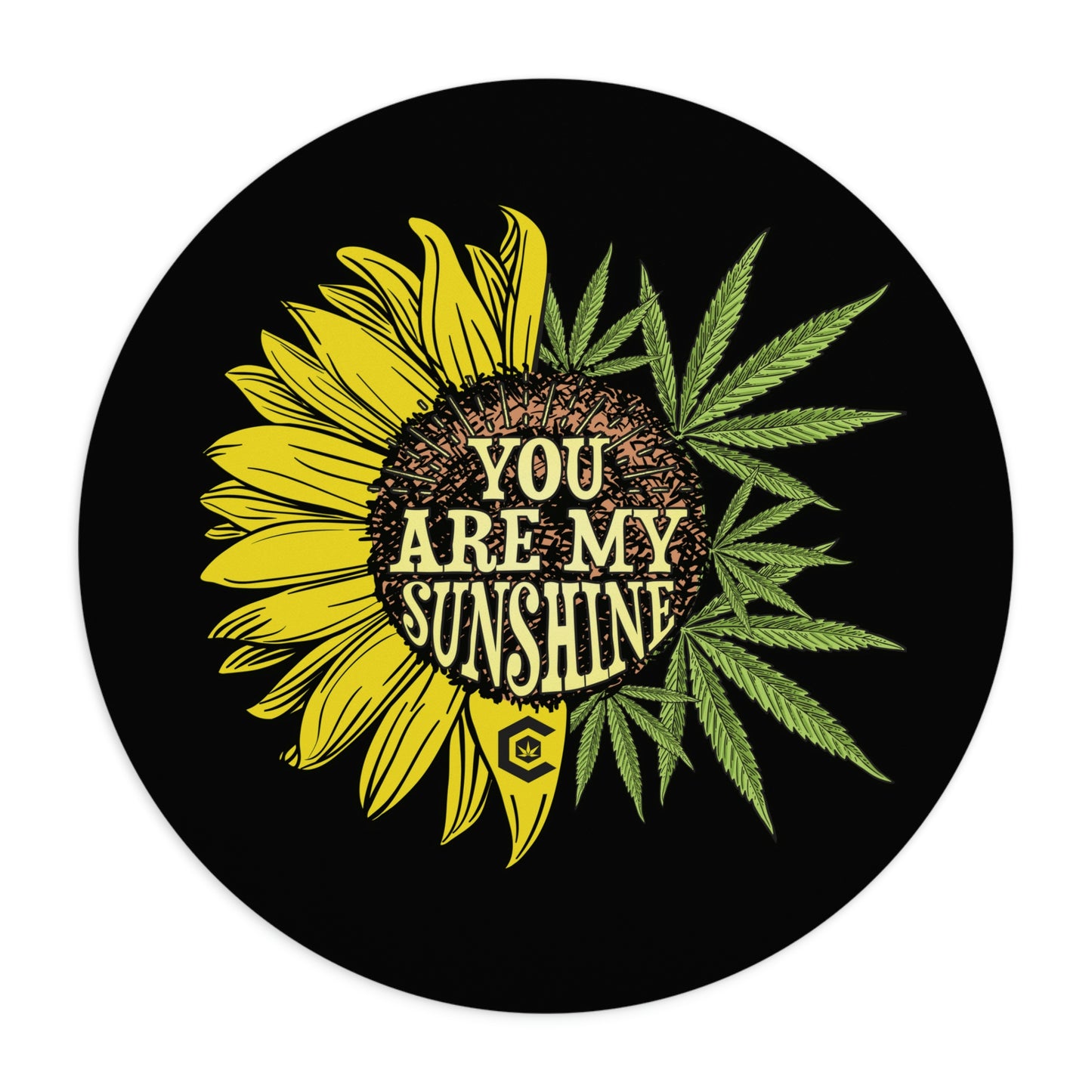 A magnificent circle You Are My Sunshine Mouse Pad that has a cool sunflower and cannabis leaf combined design to form a complete flower showing the words you are my sunshine in the middle.