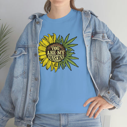 a woman wearing a You Are My Sunshine Weed T-Shirt with a sunflower on it.