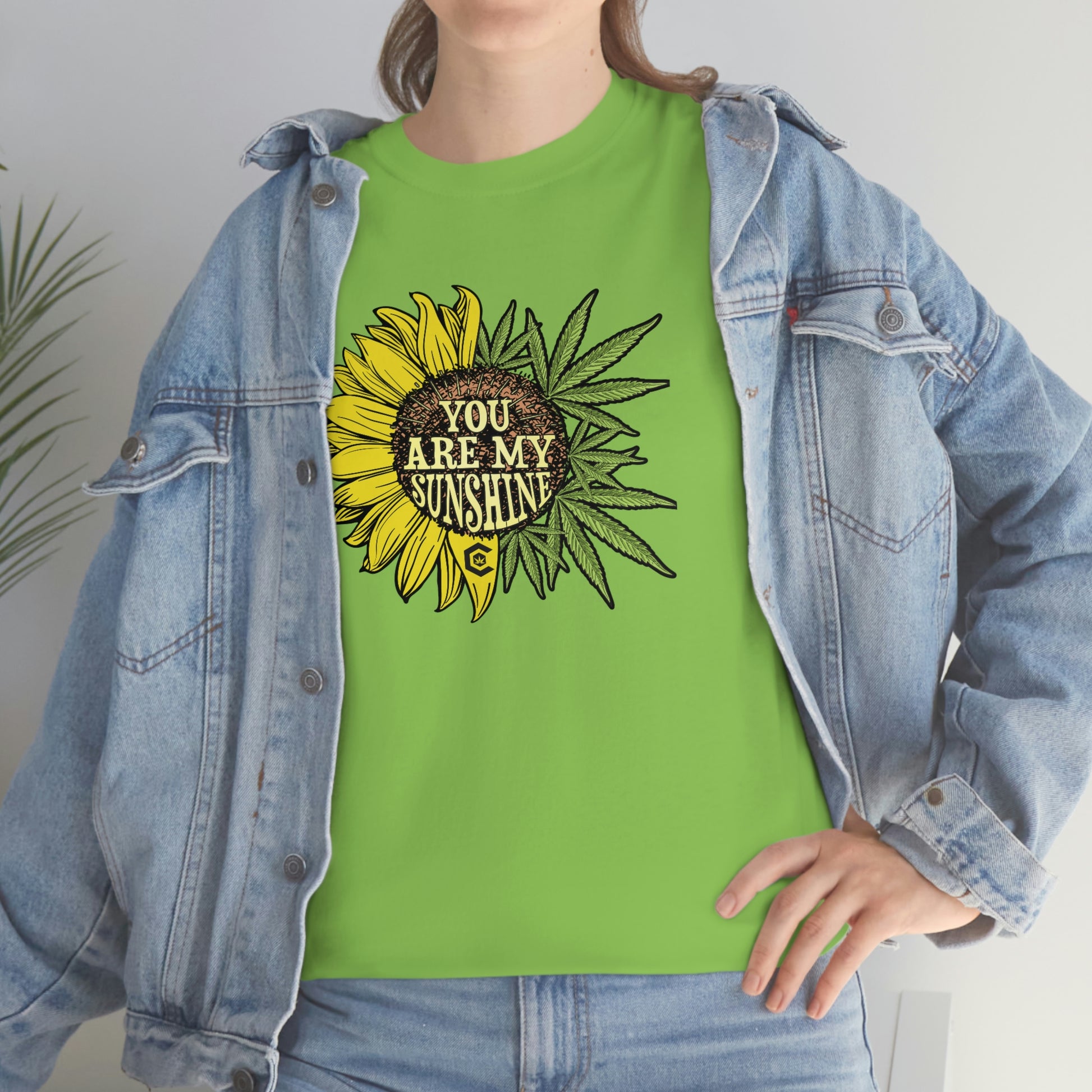 a woman wearing a You Are My Sunshine Weed T-Shirt.