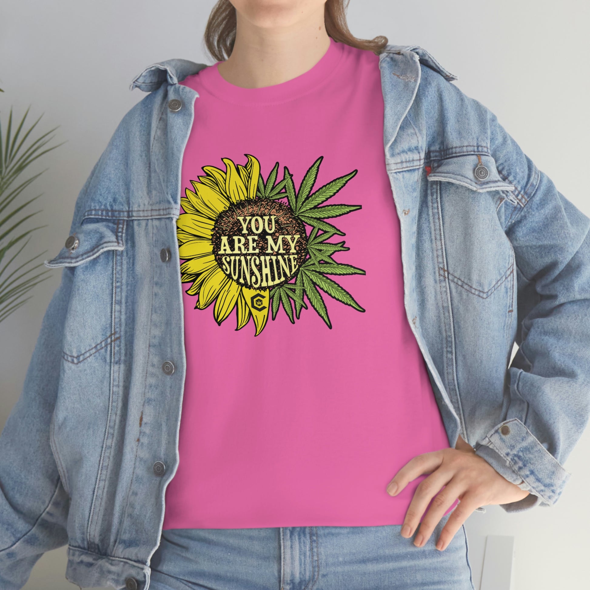 a woman wearing a pink You Are My Sunshine Weed T-Shirt