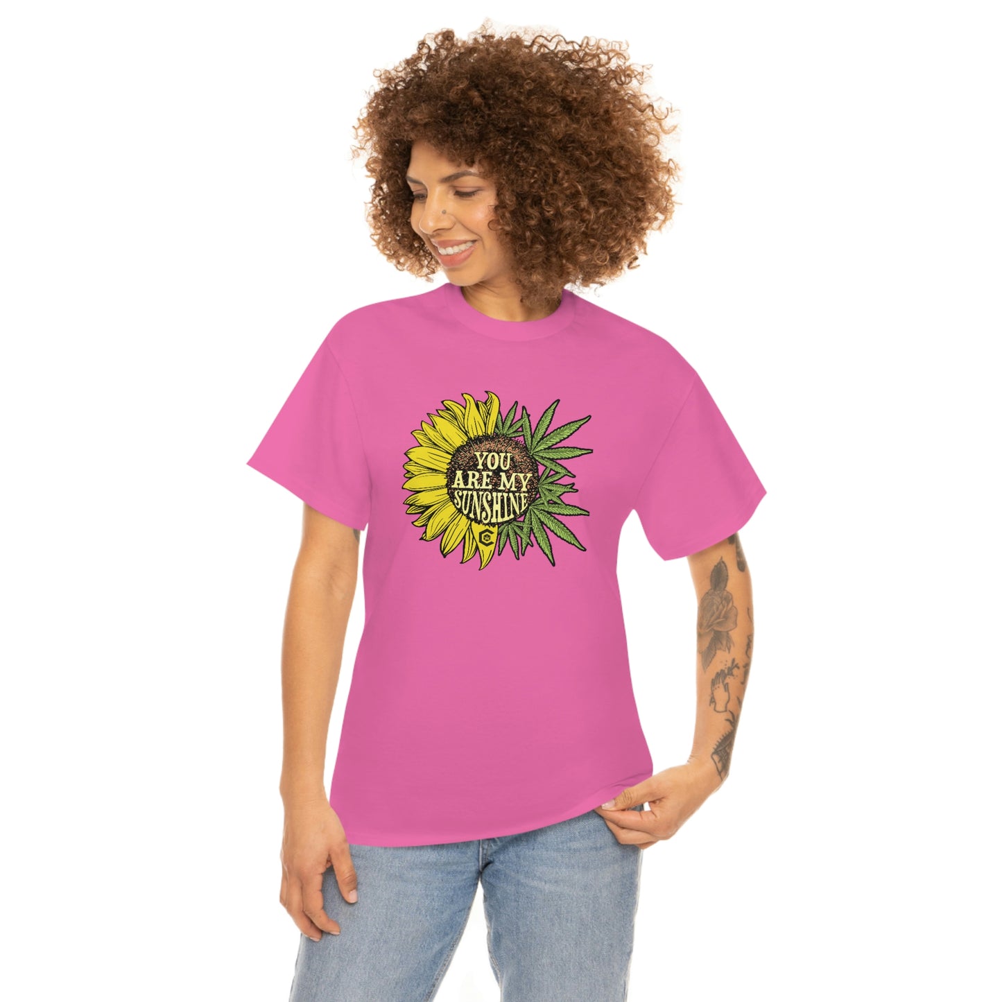 a woman wearing a pink You Are My Sunshine Weed T-Shirt with a sunflower on it.