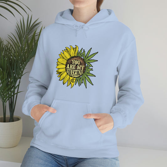 a woman wearing a "You Are My Sunshine Cannabis Sweatshirt