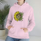 a woman wearing a pink hoodie with a You Are My Sunshine Cannabis Sweatshirt on it.