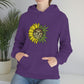 a woman wearing a purple You Are My Sunshine Cannabis Sweatshirt with a sunflower on it.