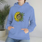 a woman wearing a blue hoodie with a You Are My Sunshine Cannabis Sweatshirt on it.