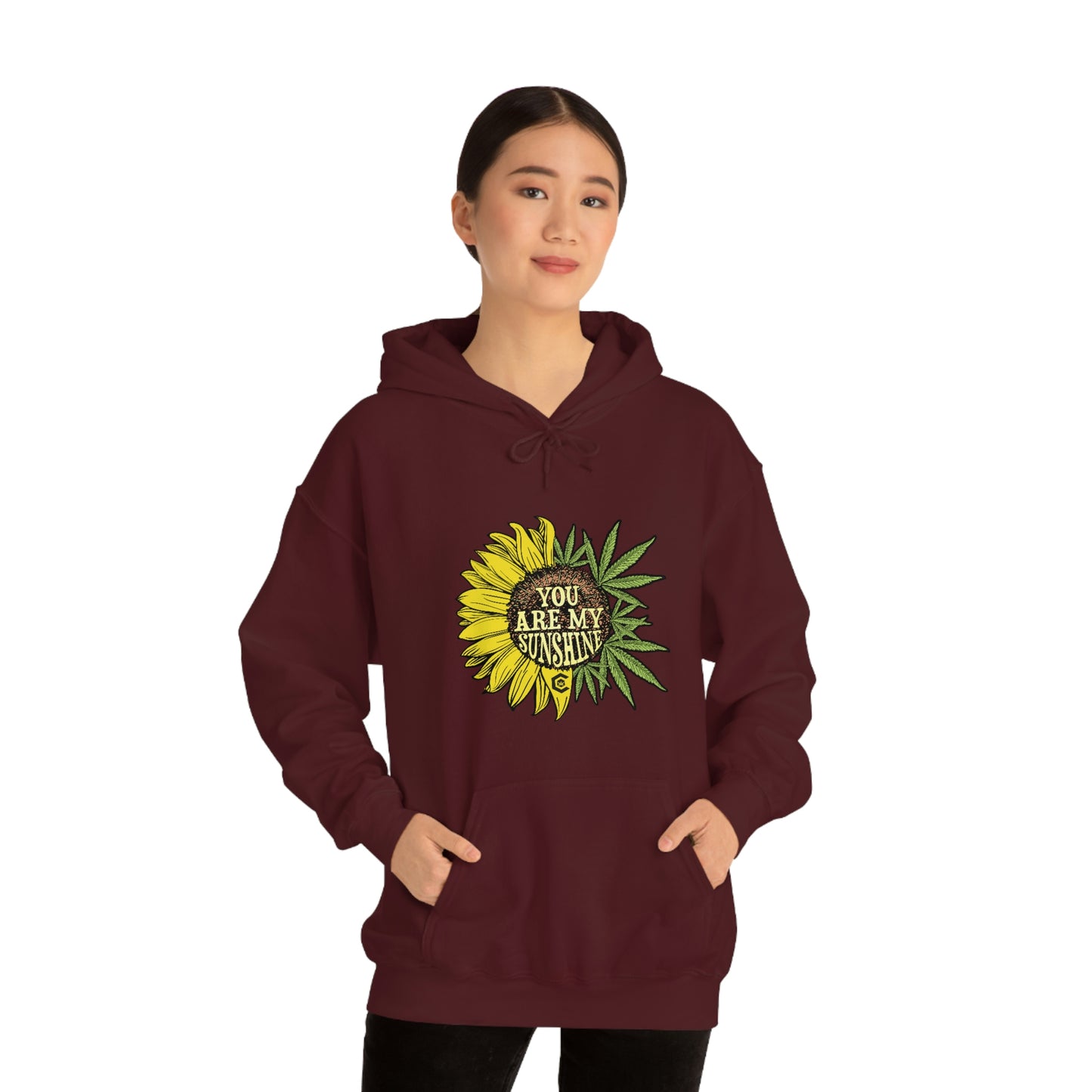a woman in a You Are My Sunshine Cannabis Sweatshirt.